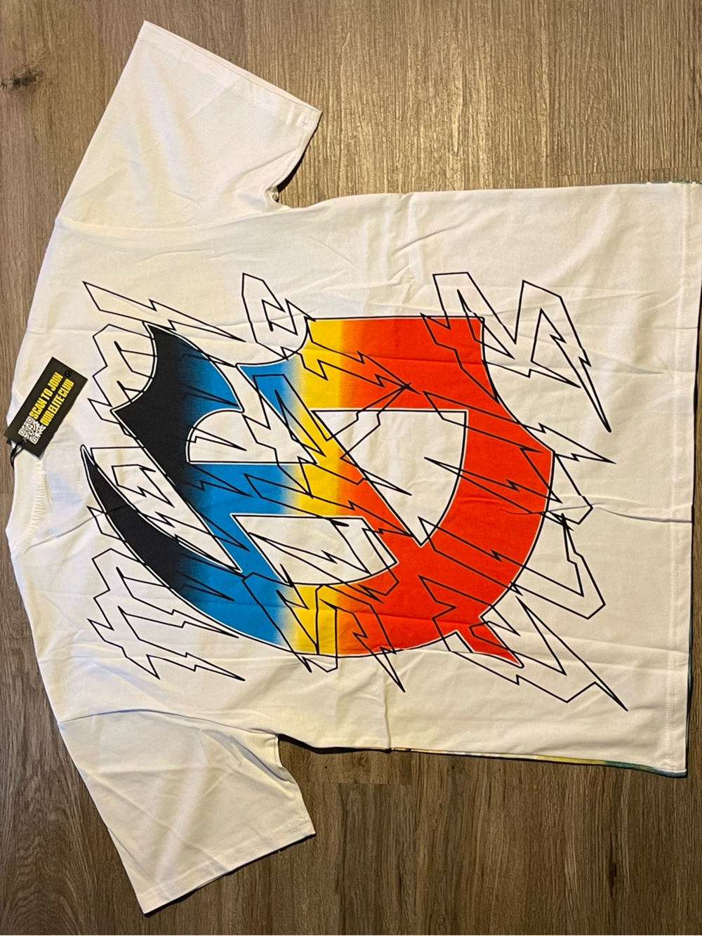 White Short-Sleeve Graphic Tee with Multicolor Lightning Emblem